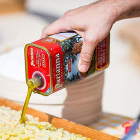 Partanna kitchen-ready EVOO tin sits for quick flavor boosts.