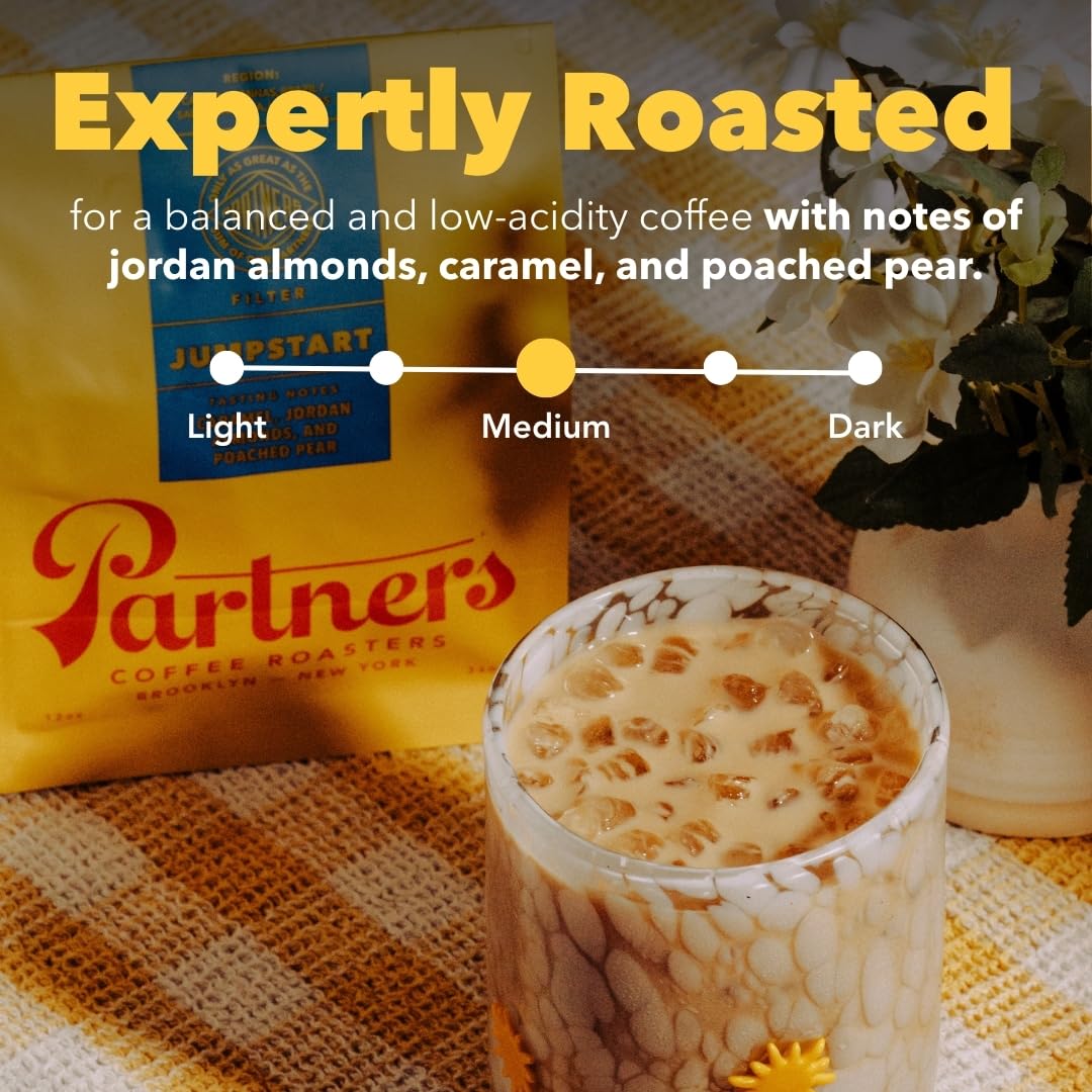 Jumpstart coffee beans closeup by Partners Coffee Roasters showing rich color and notes.