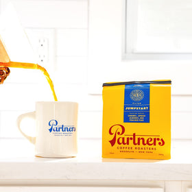 Tasting glass of Jumpstart by Partners Coffee Roasters emphasizes aroma and flavor.