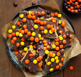 Partypom Reese Pieces displayed on a platter as a party candy option.