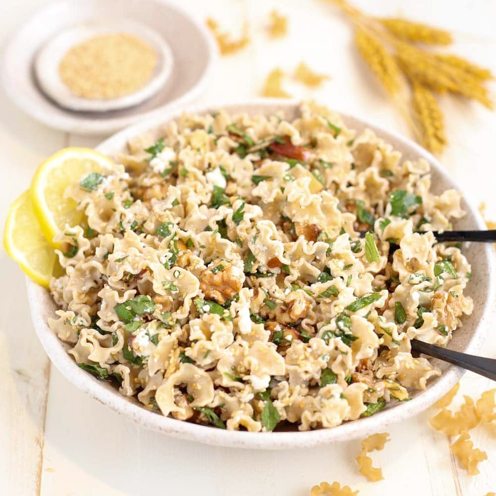 Pastabilities Protein Pasta Ruffles serving plate with a hearty bite.