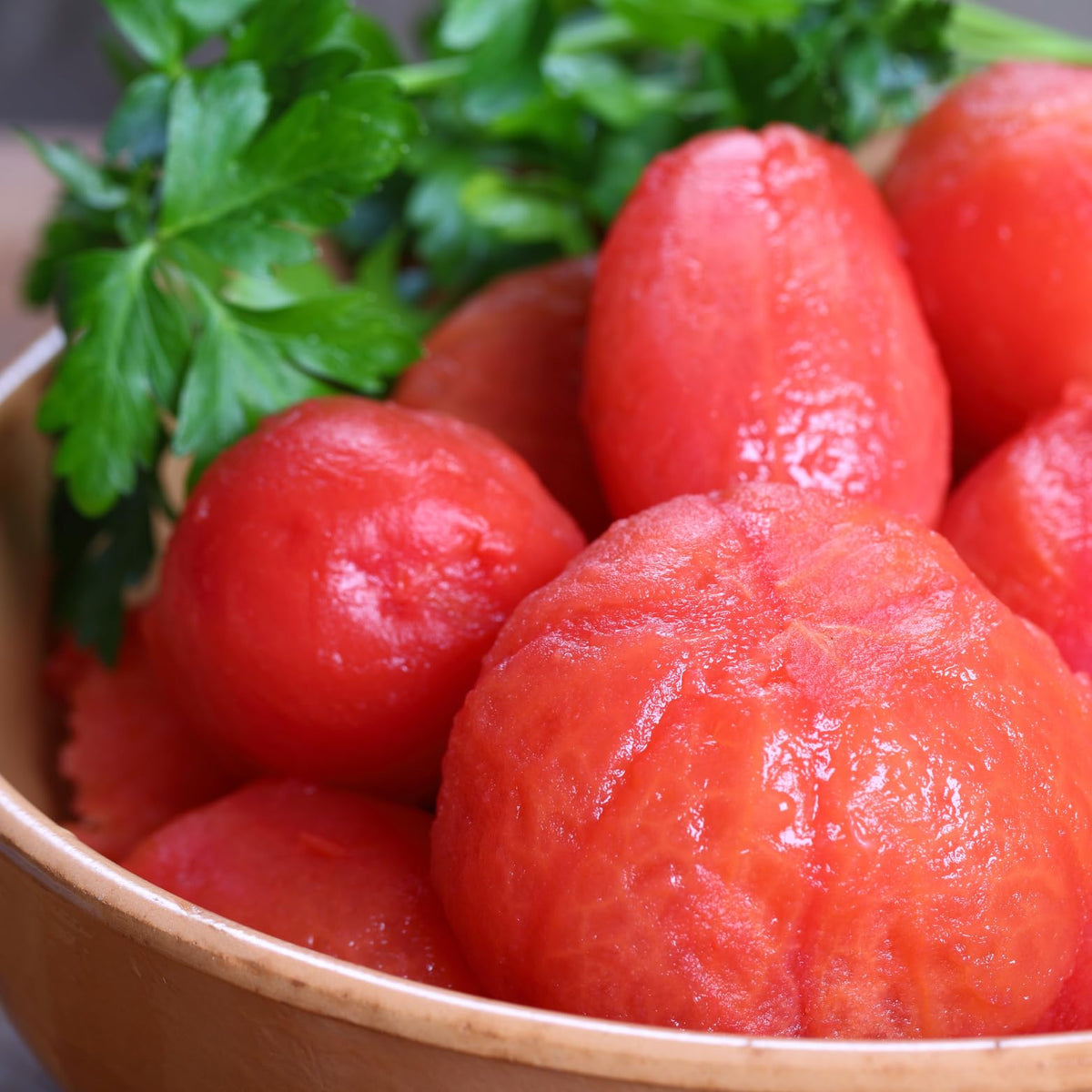 Pastene ground peeled tomatoes poured into pan for a rustic sauce.