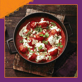 Patak's Tikka Masala served over rice with naan.