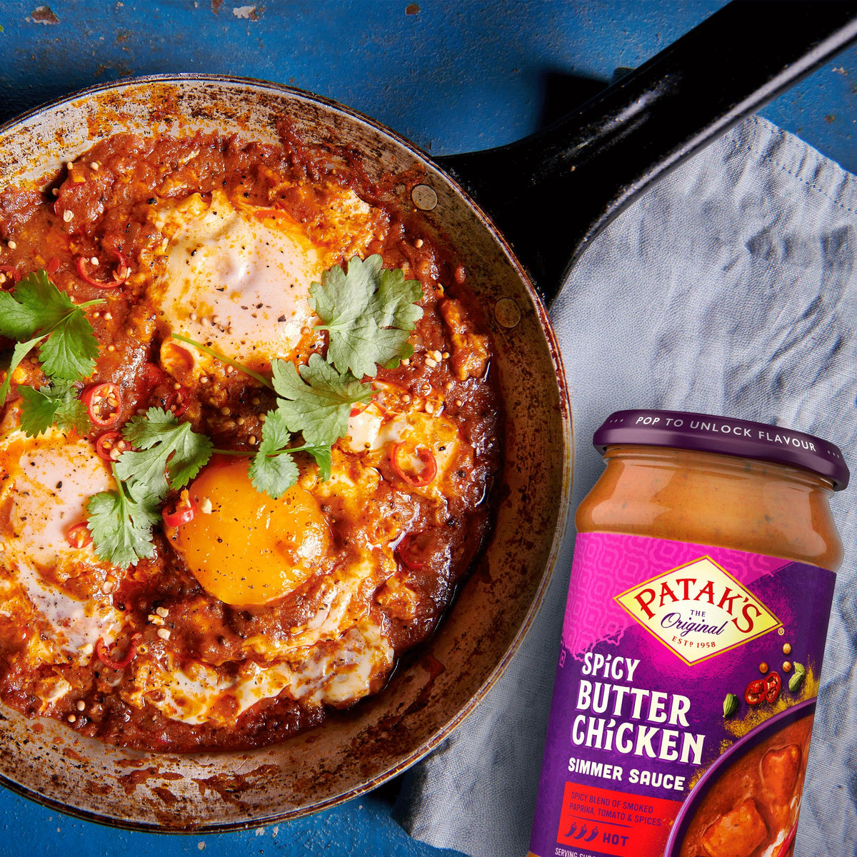 Serving bowl of Patak's sauce ready with rice or naan