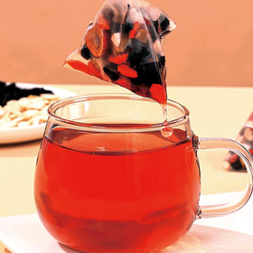 Patiosio Ginseng Five Treasure Tea maca slices yellow essence visible with earthy sweetness.