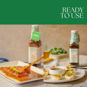 Patricia Quintana Soy & Lime Dressing glass-bottle on table signals premium artisanal quality.