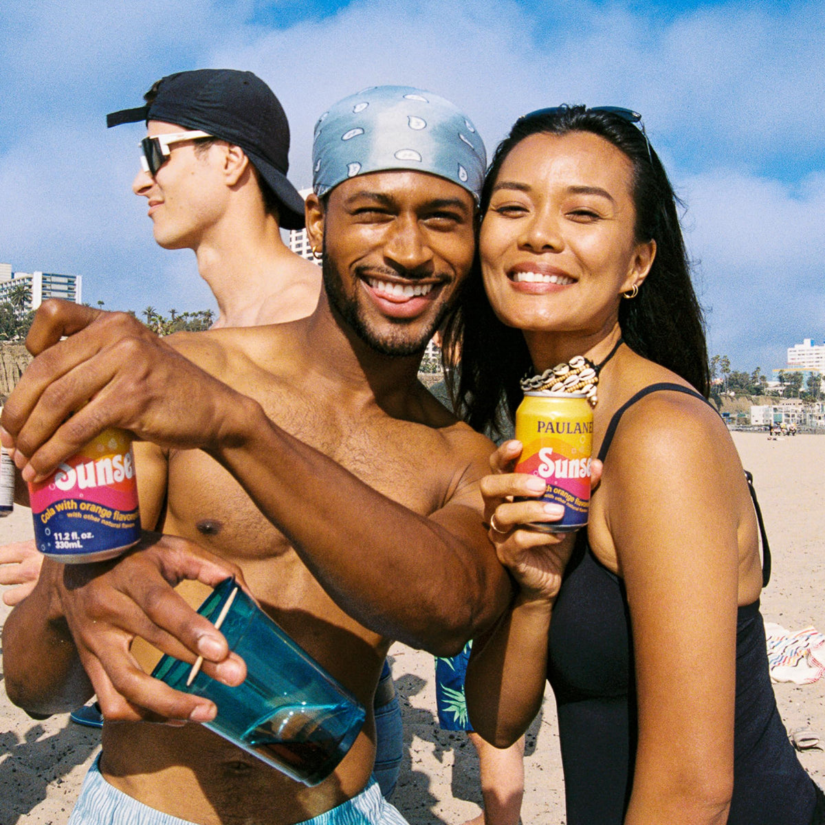 Party scene featuring Paulaner Sunset cans invites relaxed, refined enjoyment
