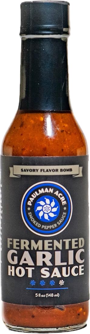 Paulman Acre Fermented Garlic Scotch Bonnet hot sauce bottle shows vibrant color and umami depth.