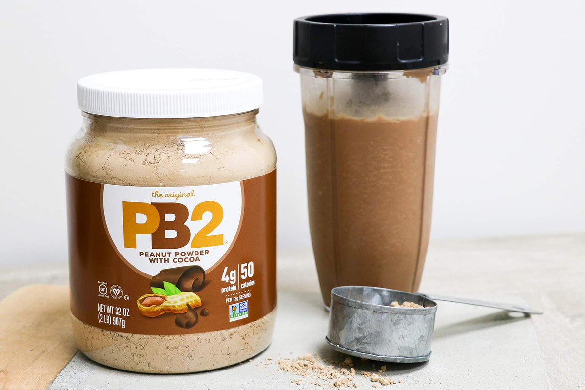 PB2 cocoa powder stirred in mug demonstrates simple chocolate flavor with fewer calories.