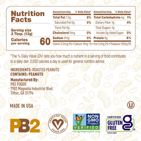 Measuring cup pouring PB2 into a recipe.