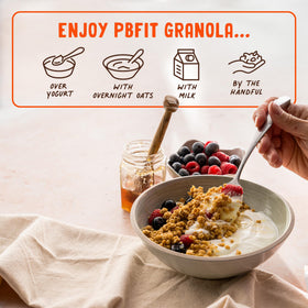 PBfit Granola in a bowl with milk highlighting crunchy texture and flavor