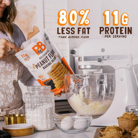 PBfit Peanut Flour Baking Blend measuring spoon ready for 1 to 1 flour substitution.