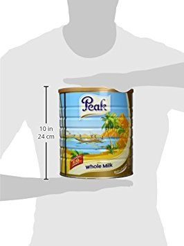Peak Dry Whole Milk Powder being mixed with hot water for instant, smooth milk.