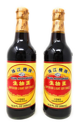 Pearl River Bridge light soy sauce bottle pouring for stir-fry flavor and control.