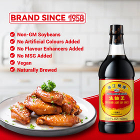 Pouring Pearl River Bridge light soy sauce to enhance a stir-fry flavor