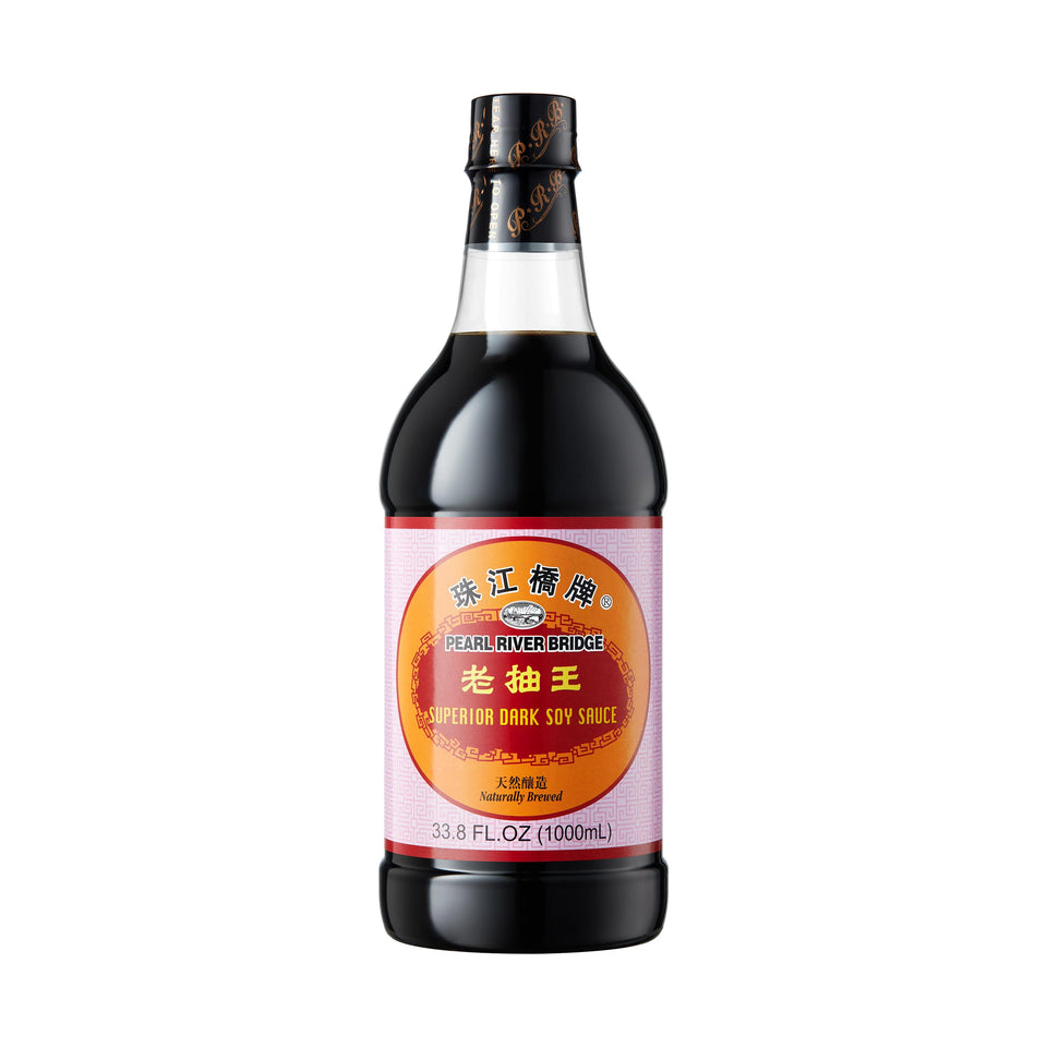 Pearl River Bridge Superior Dark Soy Sauce bottle close-up for rich, versatile flavor.