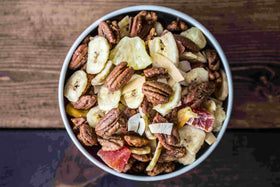 Pecan Nation honey roasted pecans arranged on a cheese board.