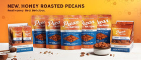 Pecan Nation pecans poured from bowl, showcasing glossy honey coating.