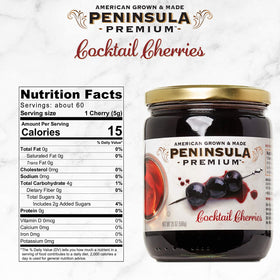 Peninsula Premium Cocktail Cherries jar detail shows glossy glaze and premium fruit