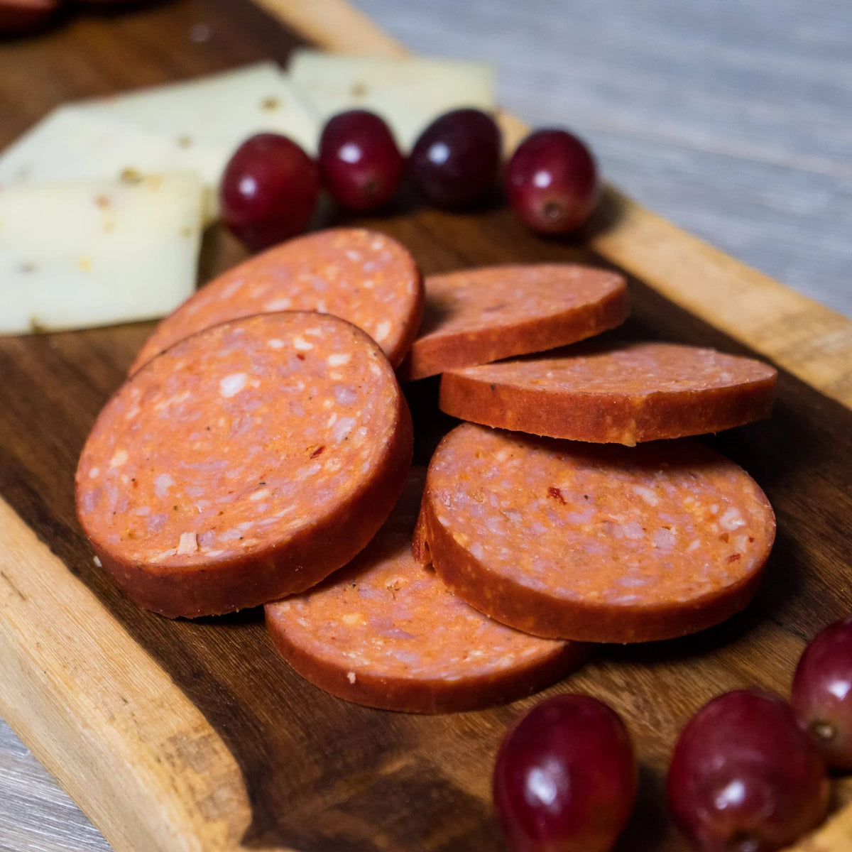 Pepper Joe's sausage on a grill, ready to add heat and flavor.