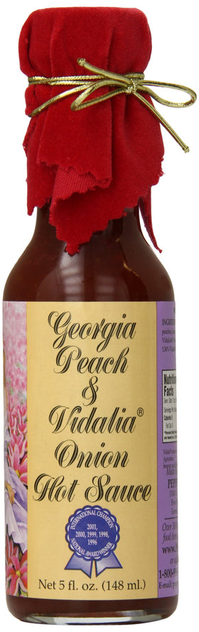 Pepper's Georgia Peach and Vidalia Onion hot sauce bottle with red velvet top on display.