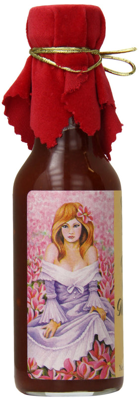 Pepper's Georgia Peach and Vidalia Onion hot sauce bottle on wings with red velvet top.
