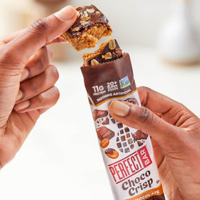 Perfect Bar Choco Crisp cashew and organic peanut butter layer close-up.