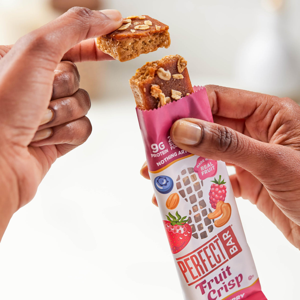Perfect Bar texture shot emphasizes oats crunch and smooth fruit layer.