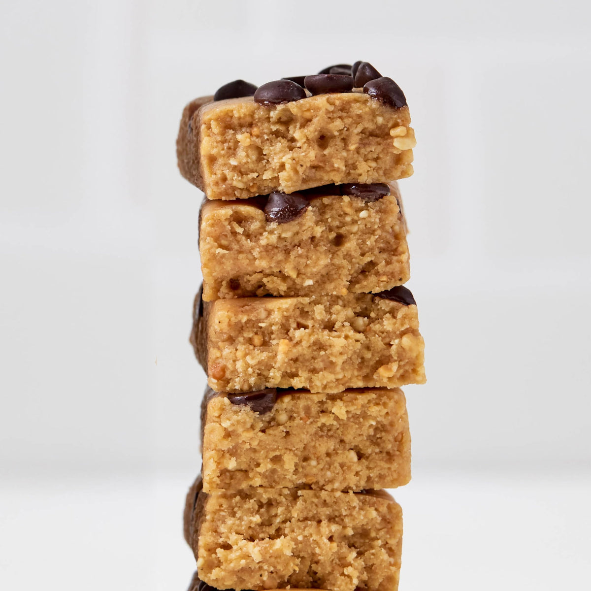 Closeup of Perfect Bar Mini showing chocolate chips and peanut butter.