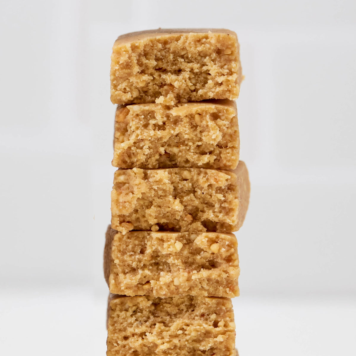 Close-up of Perfect Bar Mini showing cookie dough texture and creamy bite.
