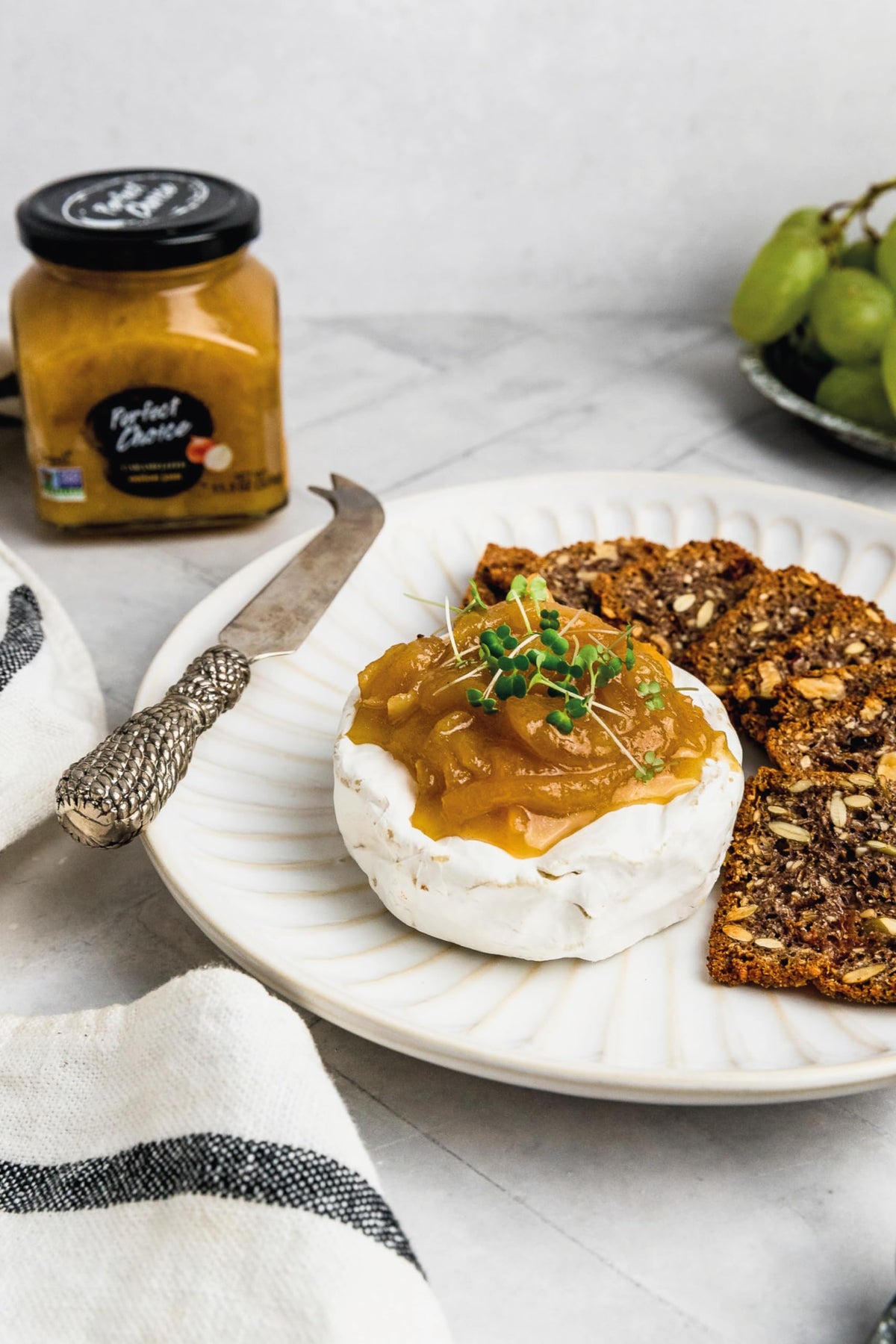 Perfect Choice caramelized onion spread on a charcuterie board adds sweetness