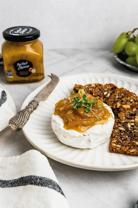 Perfect Choice caramelized onion spread on a charcuterie board adds sweetness