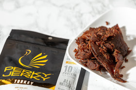 Perky Jerky gluten-free snack banner highlighting clean ingredients.