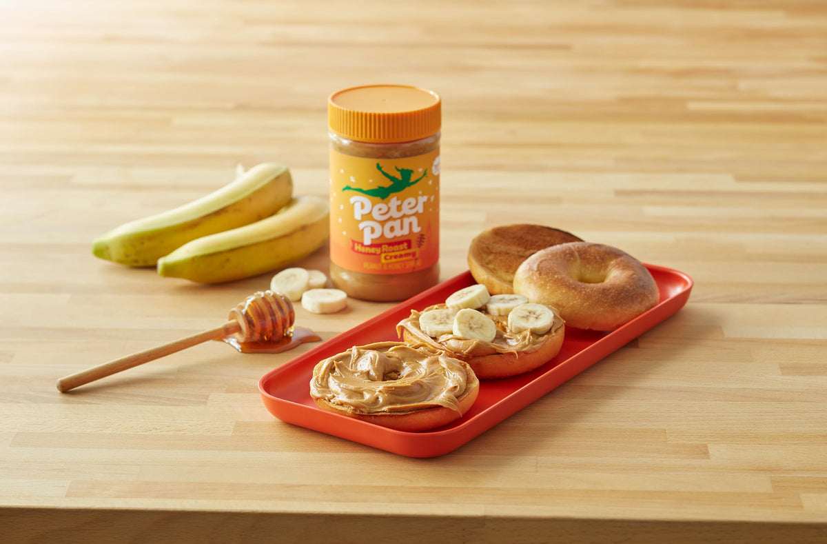Peter Pan Creamy Honey Roast Peanut Butter Spread with ultra-smooth texture for sandwiches