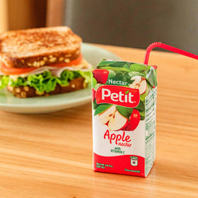 Petit Apple Nectar poured into a cup for smoothies or desserts