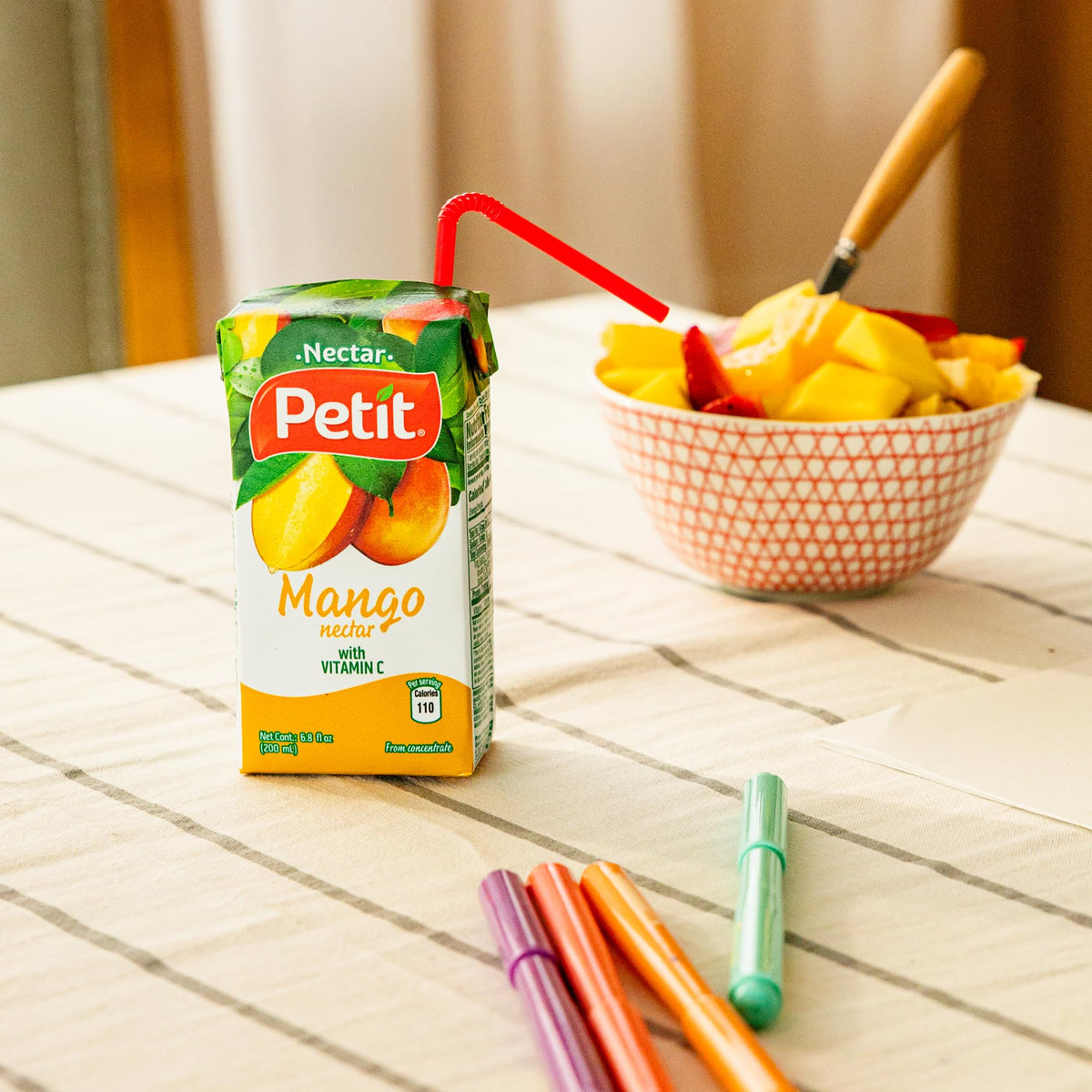 Petit Mango Nectar mango-fruit showcases source of exotic fruit flavor in every sip.