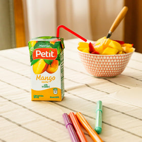 Petit Mango Nectar mango-fruit showcases source of exotic fruit flavor in every sip.