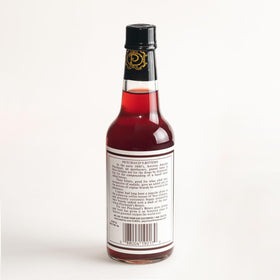 Peychaud's bottle label close-up highlighting heritage and quality