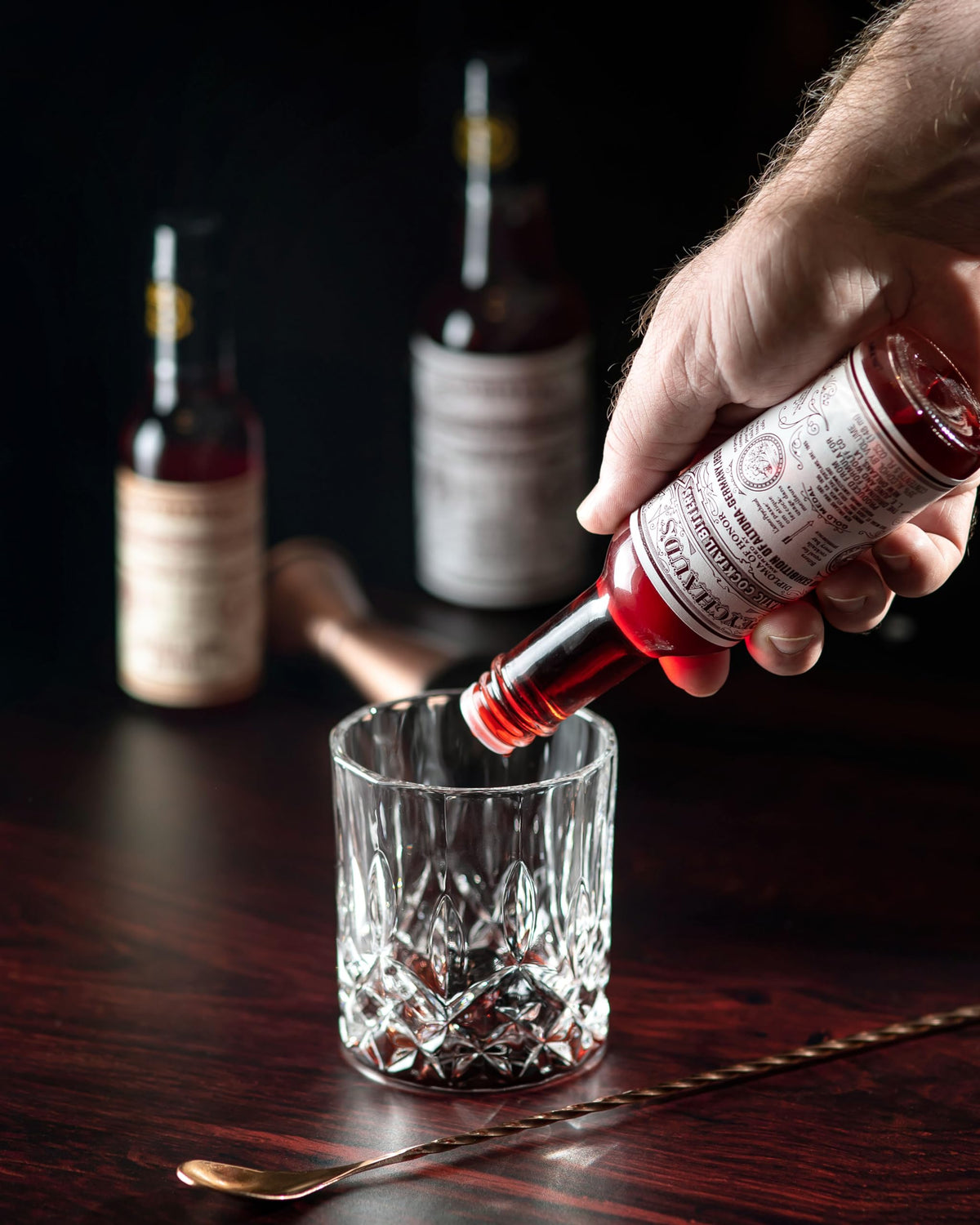 Three Peychaud's bottles displayed, emphasizing pack of 3