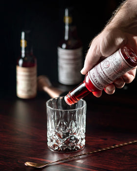 Three Peychaud's bottles displayed, emphasizing pack of 3