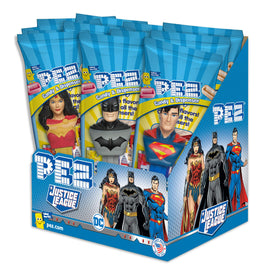 PEZ Justice League dispensers 12-pack on table, ideal for party snacks and themed decor.