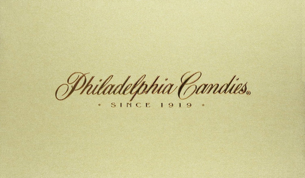 Closeup of soft-centered orange creams from Philadelphia Candies, showcasing creamy texture.
