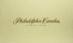 Closeup of soft-centered orange creams from Philadelphia Candies, showcasing creamy texture.