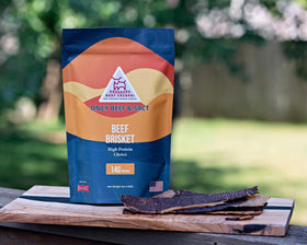 PHILLIPS BEEF CRISPS Beef Brisket snack served on a board with dips.