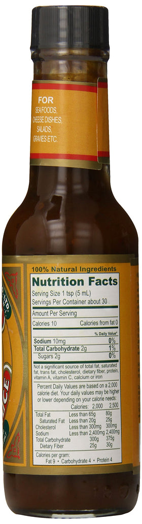 Pouring Pickapeppa Mango Hot Sauce creates a glossy glaze and seared finish.