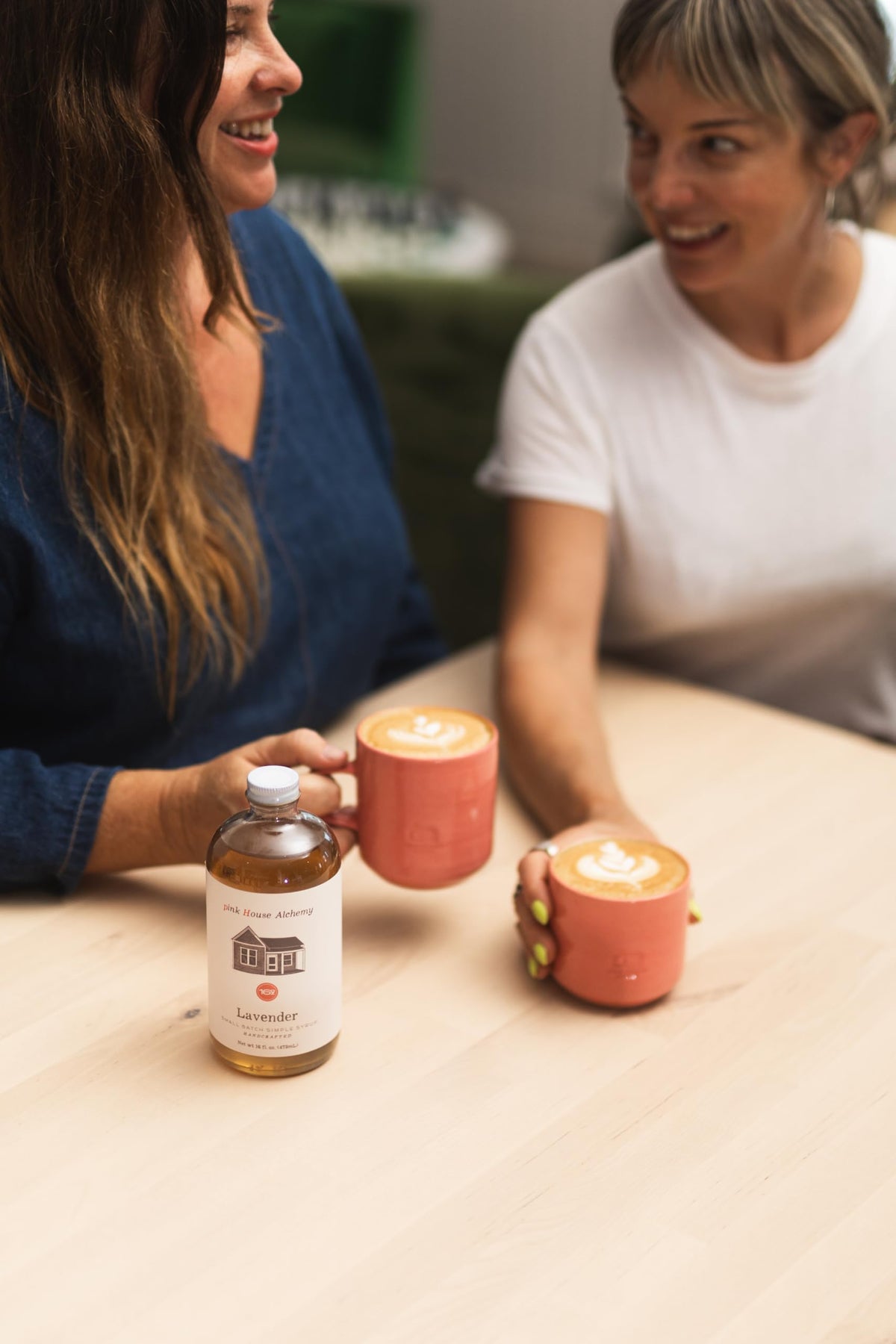 Pink House Alchemy Lavender Syrup pour in glass elevates coffee and tea with fragrant sweetness.