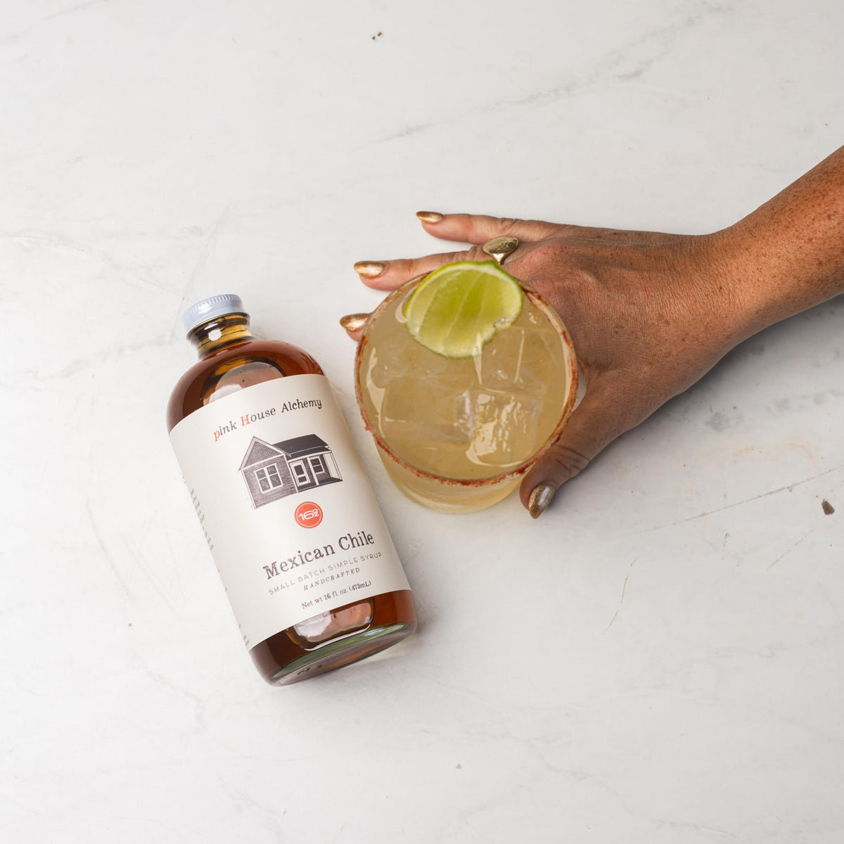 Lemonade with Pink House Alchemy Mexican Chile Simple Syrup for a smoky sweetness