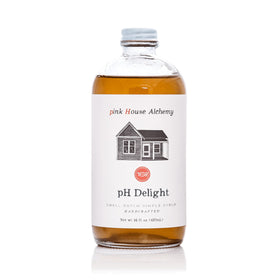 Pink House Alchemy PH Delight bottle pour enhances beverages with vanilla, cinnamon, and honey notes