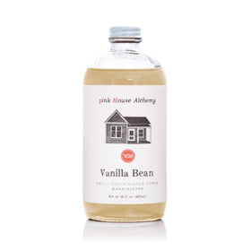 Pink House Alchemy Vanilla Bean Simple Syrup bottle enhances coffee with rich vanilla aroma