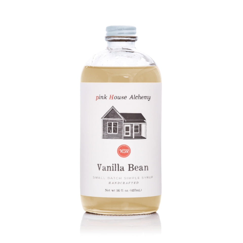 Pink House Alchemy Vanilla Bean Simple Syrup bottle enhances coffee with rich vanilla aroma